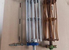 316 S/S Fertilizer Spreader next to the steel sample.